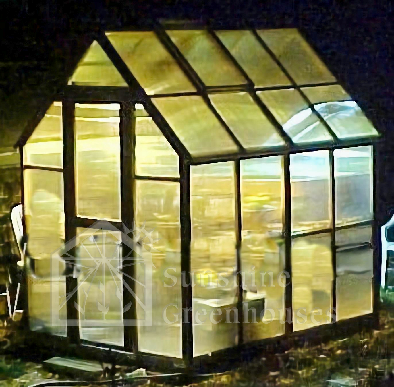 lighted night shot of a new york backyard sunshine greenhouse kit